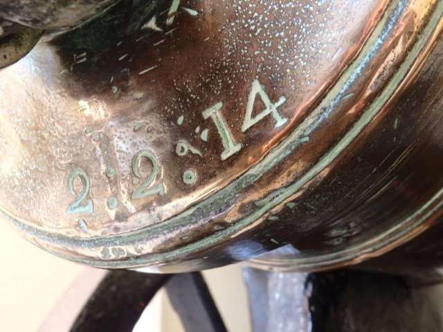 Some of the green corrosion can still be seen although it is kept highly polished.