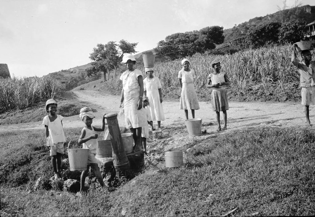 Children getting water from a standpipe near Bathsheba, circa 1936